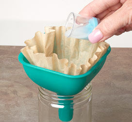 Jar of enamel being poured into the coffee filter