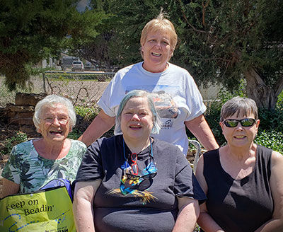 Four women smiling