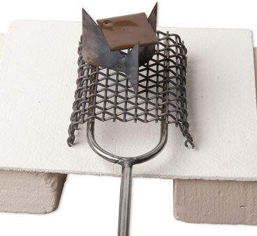 Trivet and mesh on firing fork