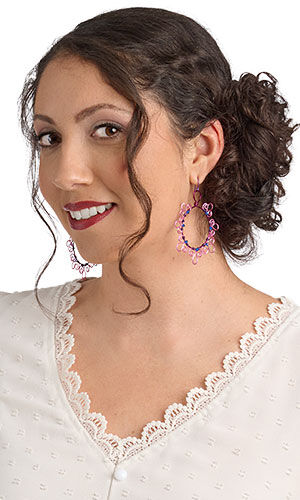 A smiling woman in white wearing Design Idea R D 2 6