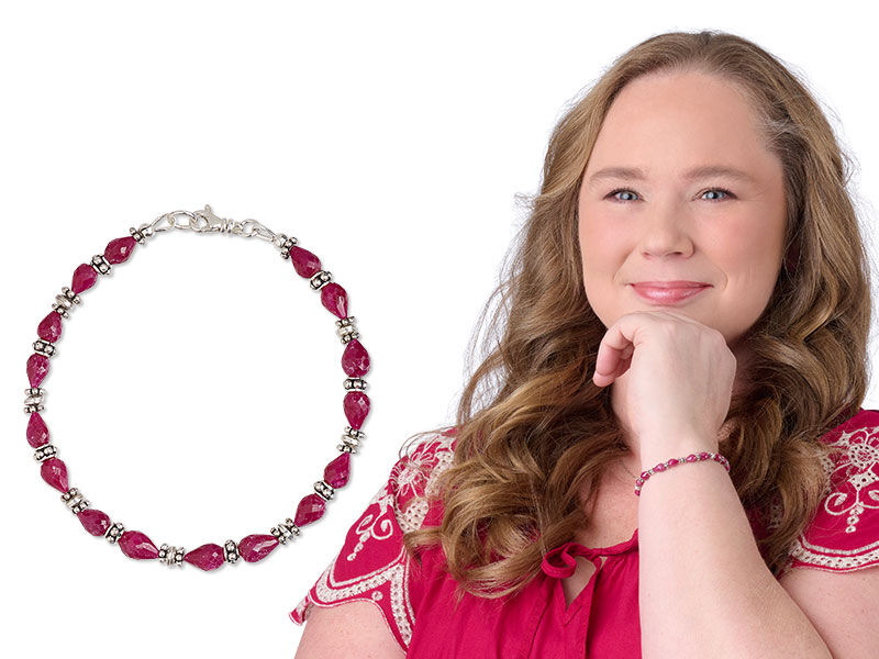 Model wearing a bracelet with ruby beads