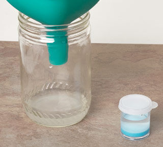 Jar next to small jar of enamel