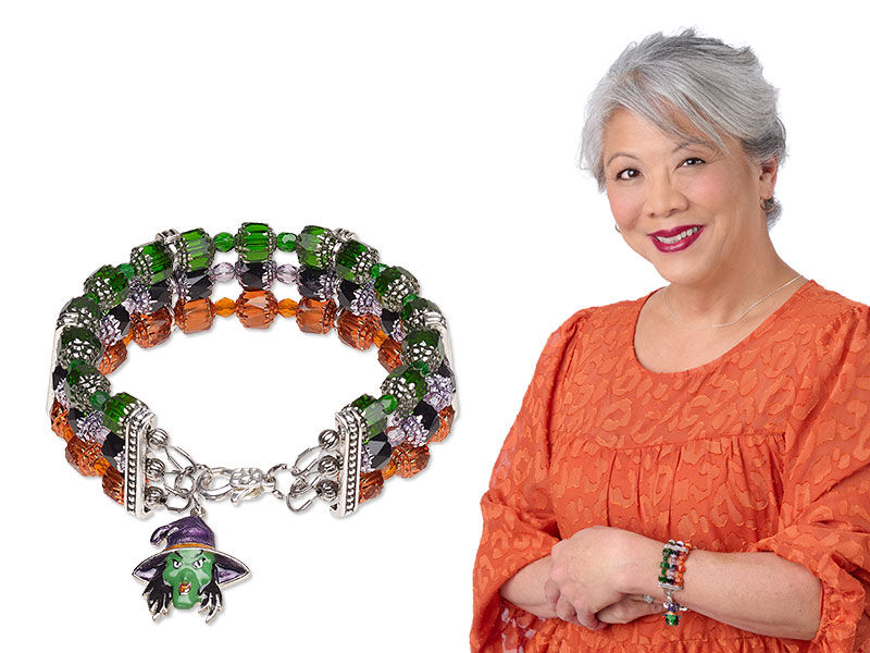 Model wearing a multi strand bracelet with a halloween theme