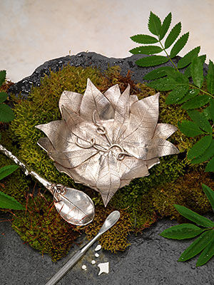 Silver Piece on a mossy display