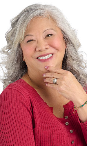 A smiling woman in red wearing Design Idea P F 2 U