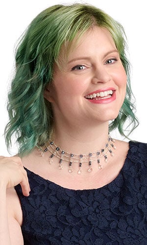 a smiling woman in blue wearing Design Idea R A 2 F