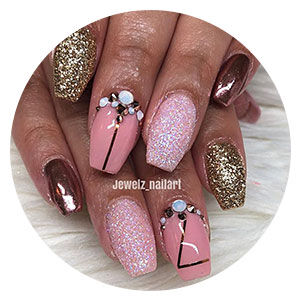 Pink nails with embellishments