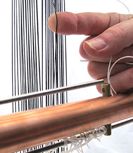 Step 35 - Insert heddle around first warp without a heddle on it