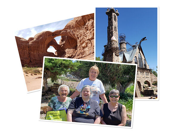 Rock formation, old building, four women posing for a picture