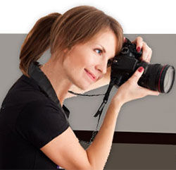 Woman looking through a camera