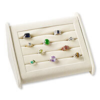A velveteen ring display holding ten various styled rings