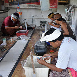 People carving bone