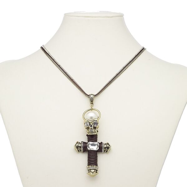 Necklace, acrylic pearl / glass / glass rhinestone / cotton cord / gold-finished brass / steel / "pewter" (zinc-based alloy), brown / clear / white, 3-1/2 x 1-3/4 inch cross with skull, 36 inches with 2-inch extender chain and lobster claw clasp. Sold individually. image number 0