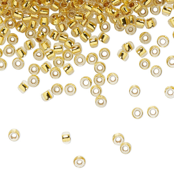Seed bead, TOHO BEADS®, glass, pkg/250g, #8 round, transparent 24Kt gold-lined crystal clear (TR-08-701). image number 0