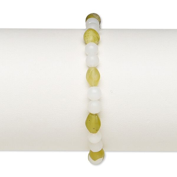 Bracelet, stretch, olive new "jade" (natural) and acrylic, white, 5mm round and 8x6mm-9x7mm oval, 7 inches. Sold individually. image number 0