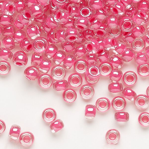 Seed bead, Miyuki, glass, pkg/25g, #6 rocaille, translucent carnation pink-lined luster crystal clear (RR-208). image number 0