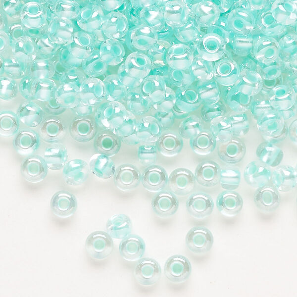 Seed bead, Preciosa Ornela Czech glass, pkg/50g, #6 rocaille, translucent color-lined luster pastel green, (382PG). image number 0
