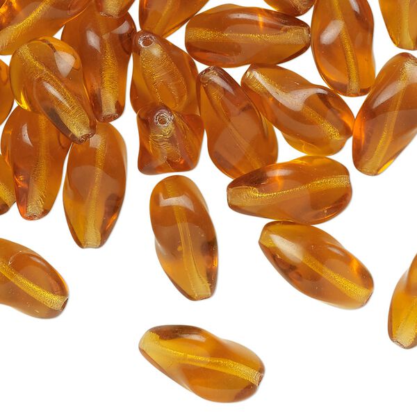 Bead, pressed glass, translucent golden honey, 14x9mm twisted freeform. Sold per 1-ounce pkg, approximately 35 beads. image number 0