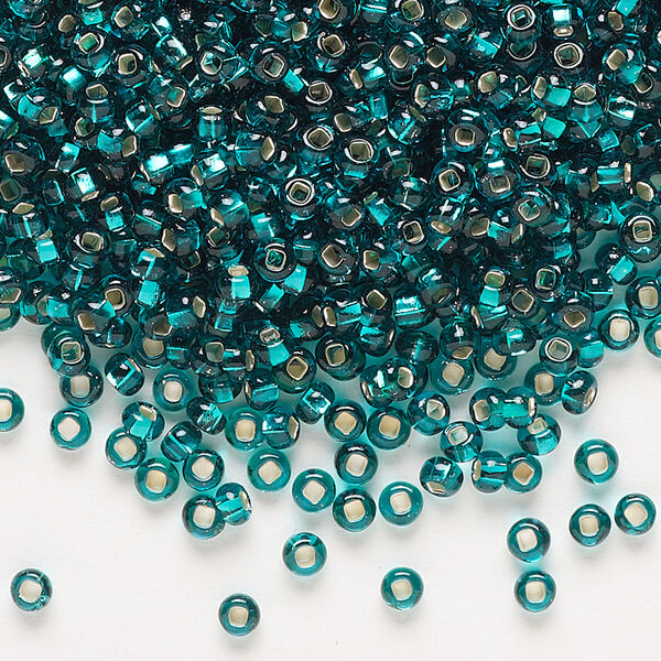 Seed bead, Preciosa Ornela Czech glass, pkg/500g, #8 rocaille, transparent silver-lined teal, (57710). image number 0