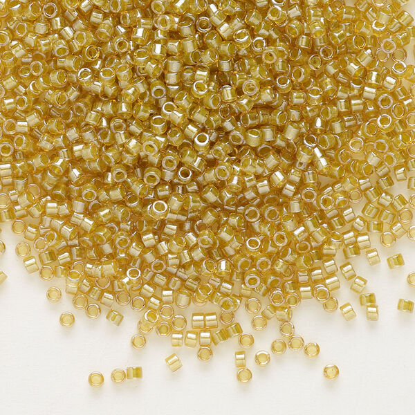 Seed bead, Delica®, glass, pkg/50g, #11 round, translucent light peridot-lined luster topaz (DB-0911). image number 0