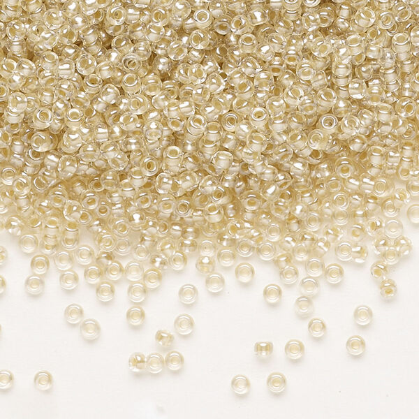 Seed bead, Preciosa Ornela, glass, translucent mocca pearl-lined crystal clear, #11 rocaille. Sold per 500-gram pkg. image number 0