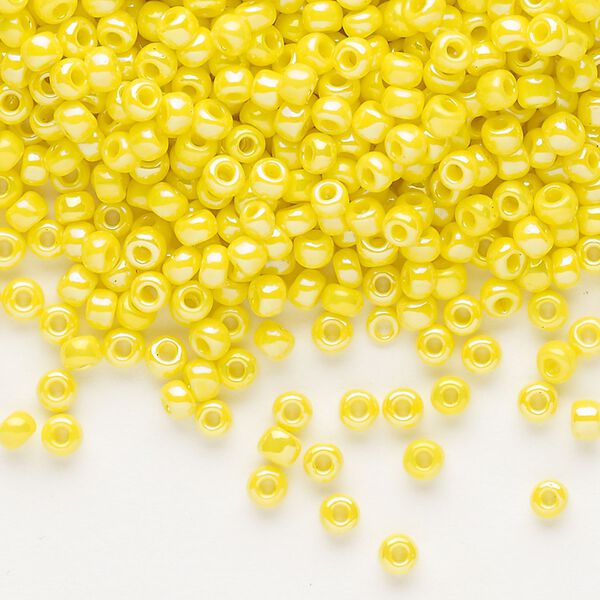 Seed bead, Dyna-Mites™, glass, opaque rainbow yellow, #8 round. Sold per 40-gram pkg. image number 0