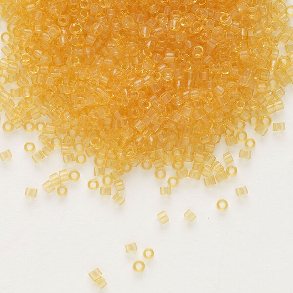 Seed bead, Delica®, glass, pkg/50g, #11 round, transparent light topaz (DB-0702). image number 0