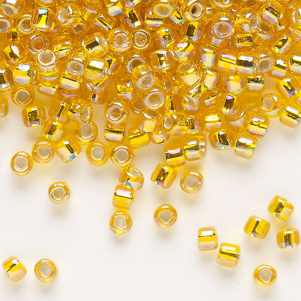 Seed bead, Dyna-Mites™, glass, silver-lined translucent rainbow orange, #6 round with square hole. Sold per 1/2 kilogram pkg. image number 0