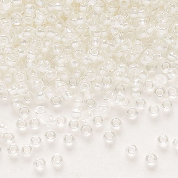 Seed bead, Preciosa Ornela Czech glass, pkg/50g, #11 rocaille, translucent color-lined luster pastel ivory, (382PI). image number 0