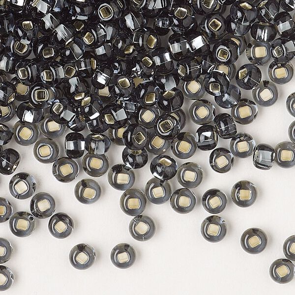 Seed bead, Preciosa Ornela Czech glass, pkg/50g, #6 rocaille, transparent silver-lined grey, (47010). image number 0