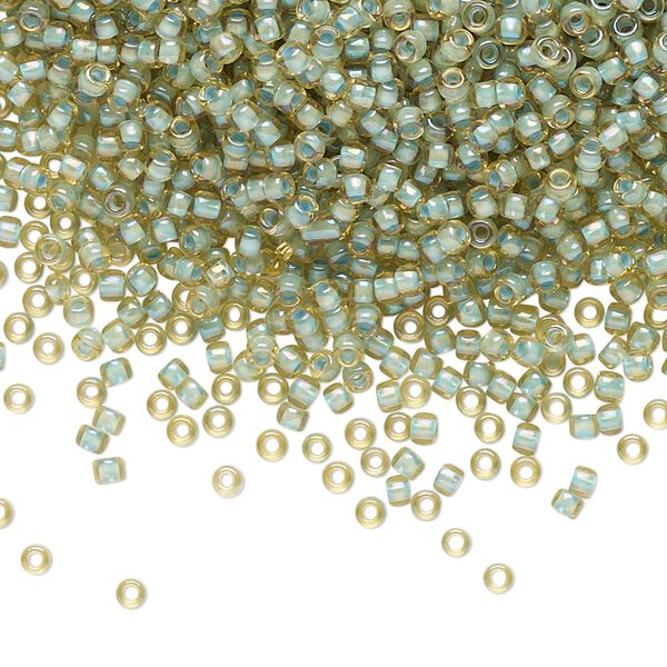 Seed bead, TOHO BEADS®, glass, pkg/50g, #11 round, opaque color-lined seafoam light topaz (TR-11-952). image number 0