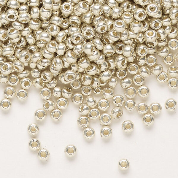 Seed bead, Preciosa Ornela Czech glass, pkg/50g, #8 rocaille, opaque silver finish metallic clear, (18303). image number 0