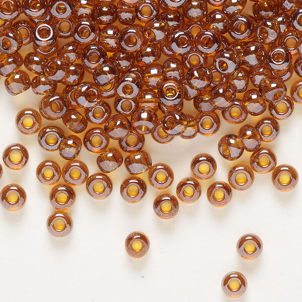 Seed bead, Preciosa Ornela Czech glass, pkg/50g, #6 rocaille, translucent luster topaz, (16090). image number 0