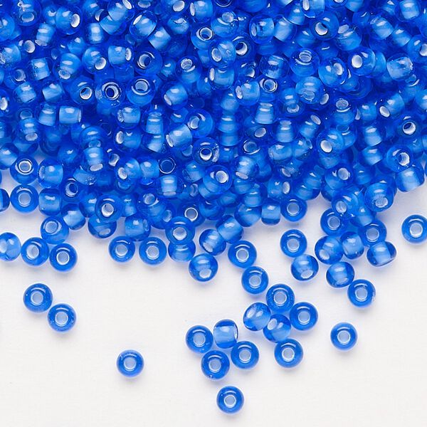 Seed bead, Preciosa Ornela, glass, transparent chalkwhite-lined sapphire, #8 rocaille. Sold per 50-gram pkg. image number 0
