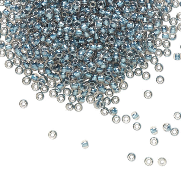 Seed bead, TOHO BEADS®, glass, pkg/50g, #11 round, translucent metallic blue-lined crystal clear (TR-11-288). image number 0