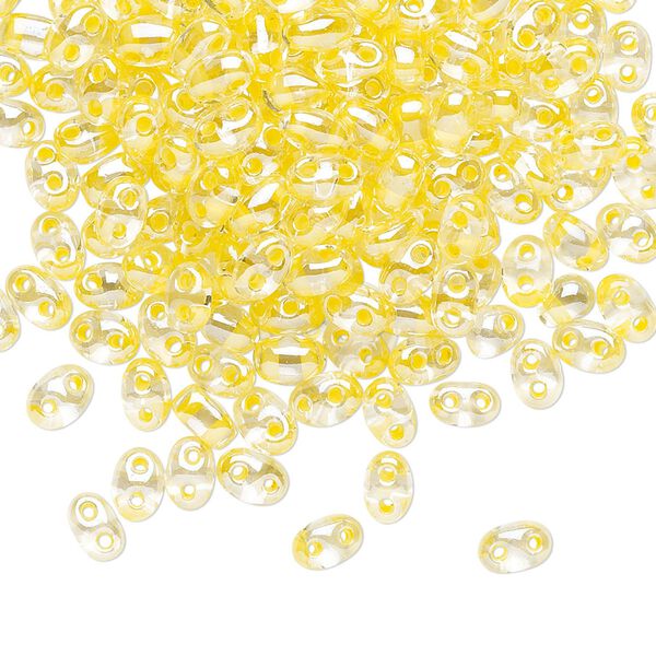 Seed bead, Preciosa Twin™ Czech glass, pkg/250g, 5x2.5mm oval, transparent yellow terra color-lined clear, (38686). image number 0