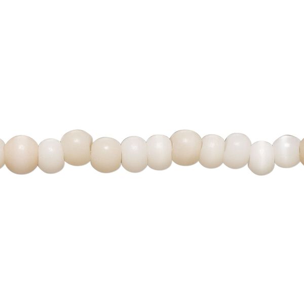 Bead, cat's eye glass (fiber optic glass), soft pink, 5x4mm-6x5mm rondelle and irregular round. Sold per 14-inch strand, approximately 100 beads. image number 0