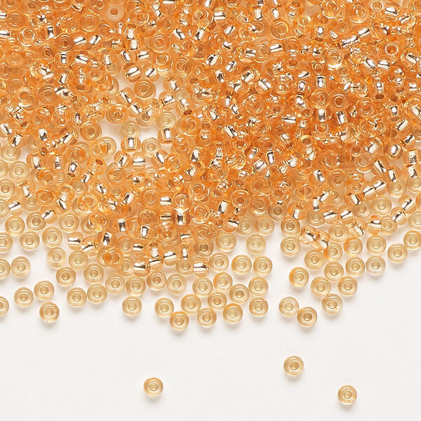 Seed bead, Preciosa Ornela Czech glass, pkg/50g, #11 rocaille, translucent solgel dyed silver-lined peach, (78184). image number 0
