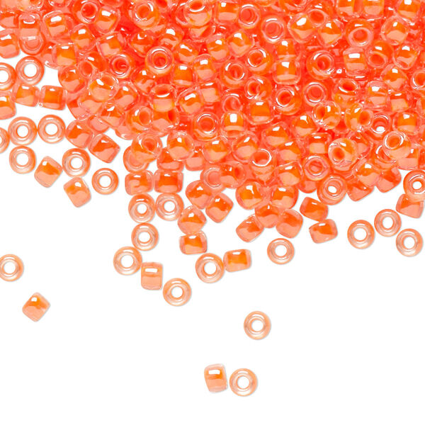 Seed bead, TOHO BEADS®, glass, pkg/250g, #8 round, translucent luminous inside color neon salmon (TR-08-803). image number 0
