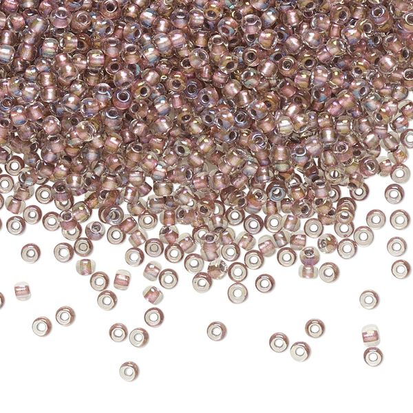 Seed bead, TOHO BEADS®, glass, pkg/250g, #11 round, translucent rose gold-lined crystal clear (TR-11-267). image number 0