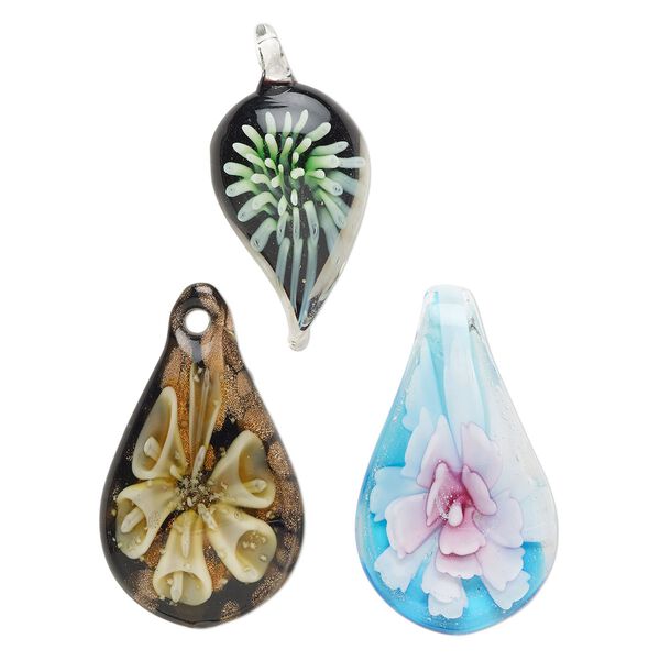 Random focal mix, lampworked glass, pkg/3,  38x17mm-60x31mm mixed shapes with flower, opaque and translucent mixed colors with silver-colored foil and copper-colored glitter. image number 0