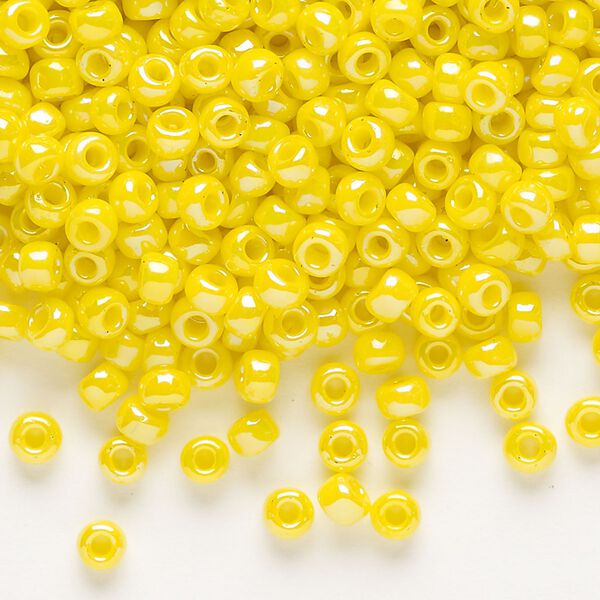 Seed bead, Dyna-Mites™, glass, opaque rainbow yellow, #6 round. Sold per 1/2 kilogram pkg. image number 0