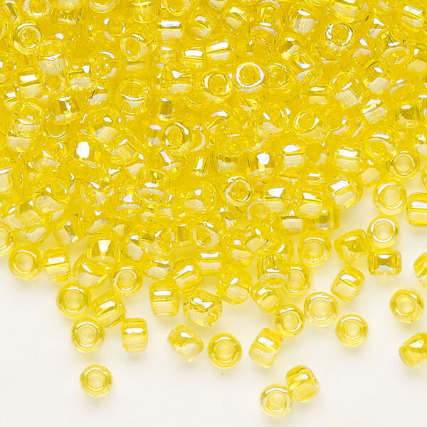 Seed bead, Dyna-Mites™, glass, transparent rainbow yellow, #6 round. Sold per 1/2 kilogram pkg. image number 0