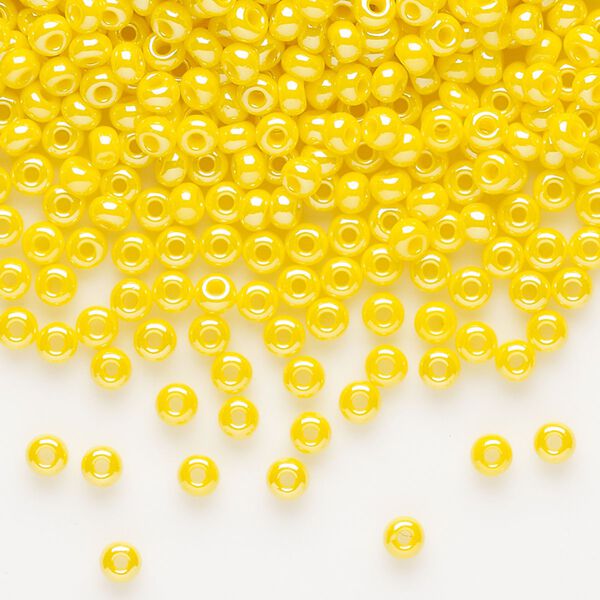 Seed bead, Preciosa Ornela, glass, opaque luster yellow, #8 rocaille. Sold per 50-gram pkg. image number 0