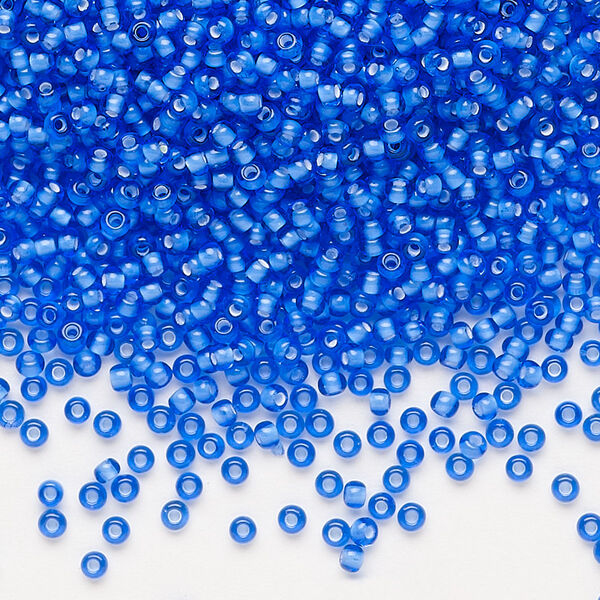 Seed bead, Preciosa Ornela, glass, transparent chalkwhite-lined sapphire, #11 rocaille. Sold per 500-gram pkg. image number 0