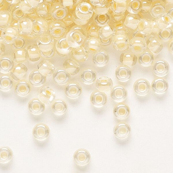 Seed bead, Miyuki, glass, pkg/250g, #6 rocaille, translucent ivory-lined luster crystal clear (RR-2215). image number 0