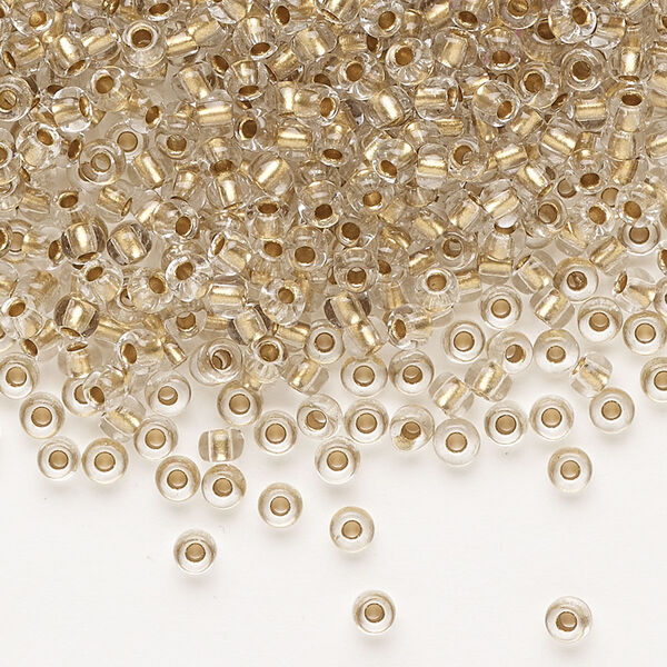 Seed bead, Preciosa Ornela Czech glass, pkg/50g, #8 rocaille, transparent metallic bronze-lined clear, (68106). image number 0