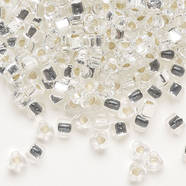 Seed bead, Miyuki, glass, silver-lined translucent clear, (TR1101), #5 triangle. Sold per 250-gram pkg. image number 0
