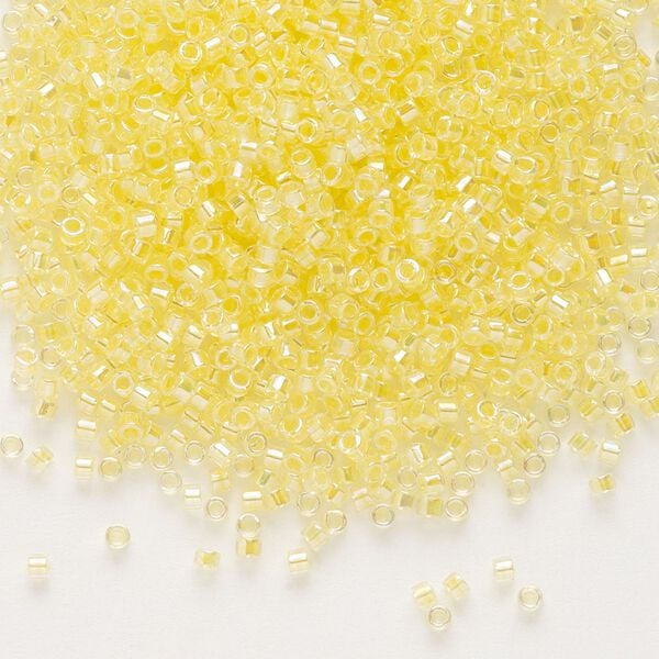 Seed bead, Delica®, glass, pkg/7.5g, #11 round, translucent light yellow-lined rainbow crystal clear (DB-0053). image number 0