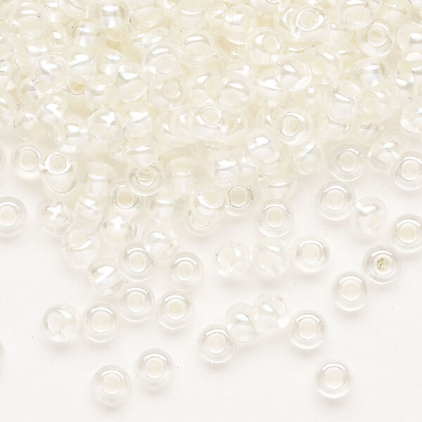 Seed bead, Preciosa Ornela Czech glass, pkg/50g, #6 rocaille, translucent color-lined luster pastel ivory, (382PI). image number 0